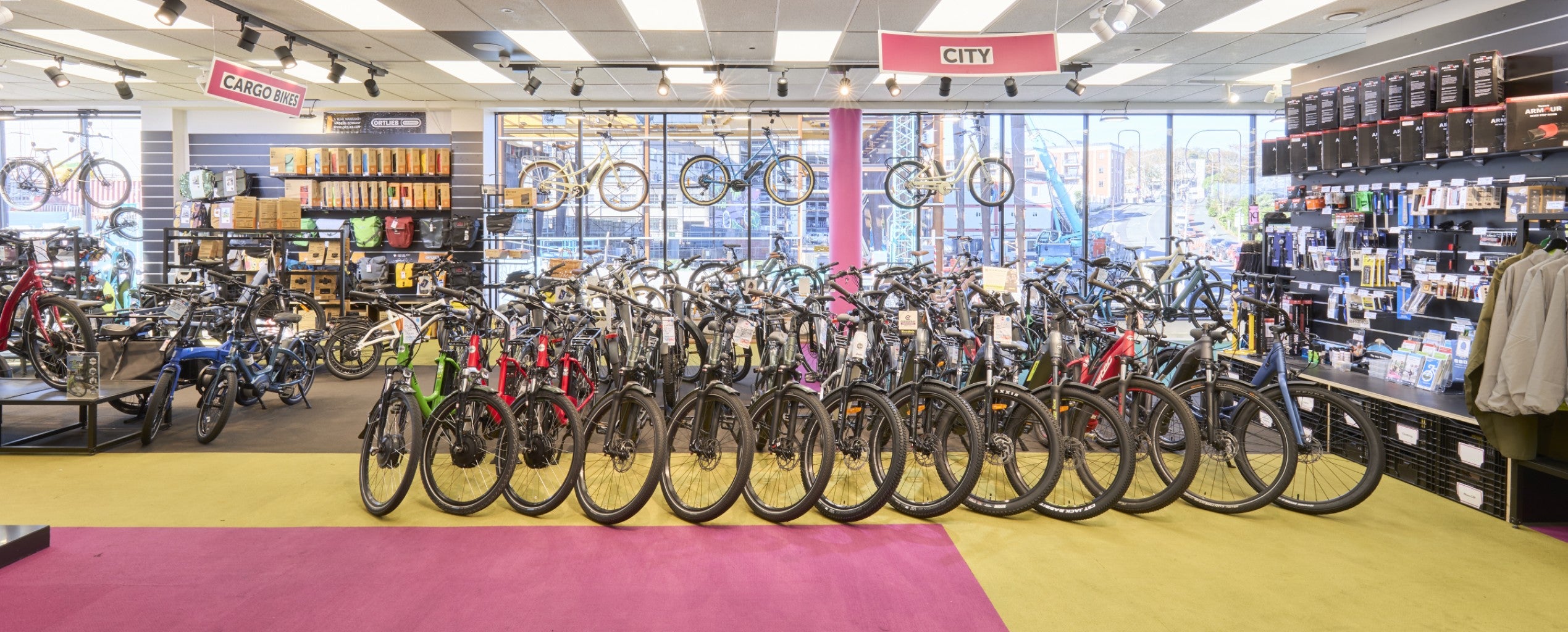 Naturally lit EBT showroom floor showing generous selection of e-bikes and accessories